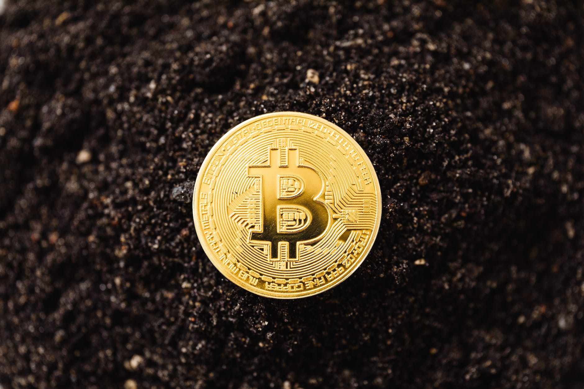 close up shot of a bitcoin on the ground