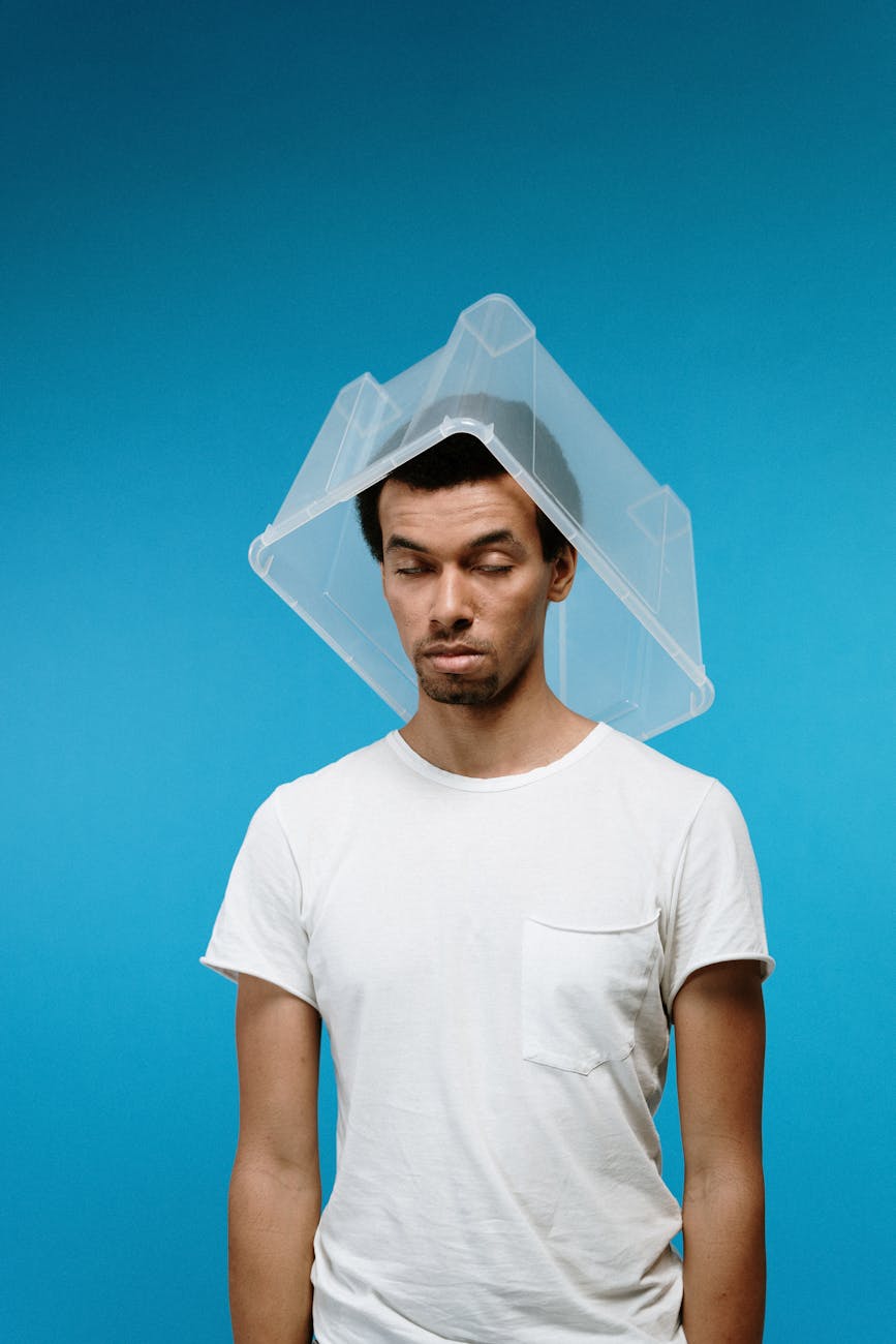 man wearing plastic box on head